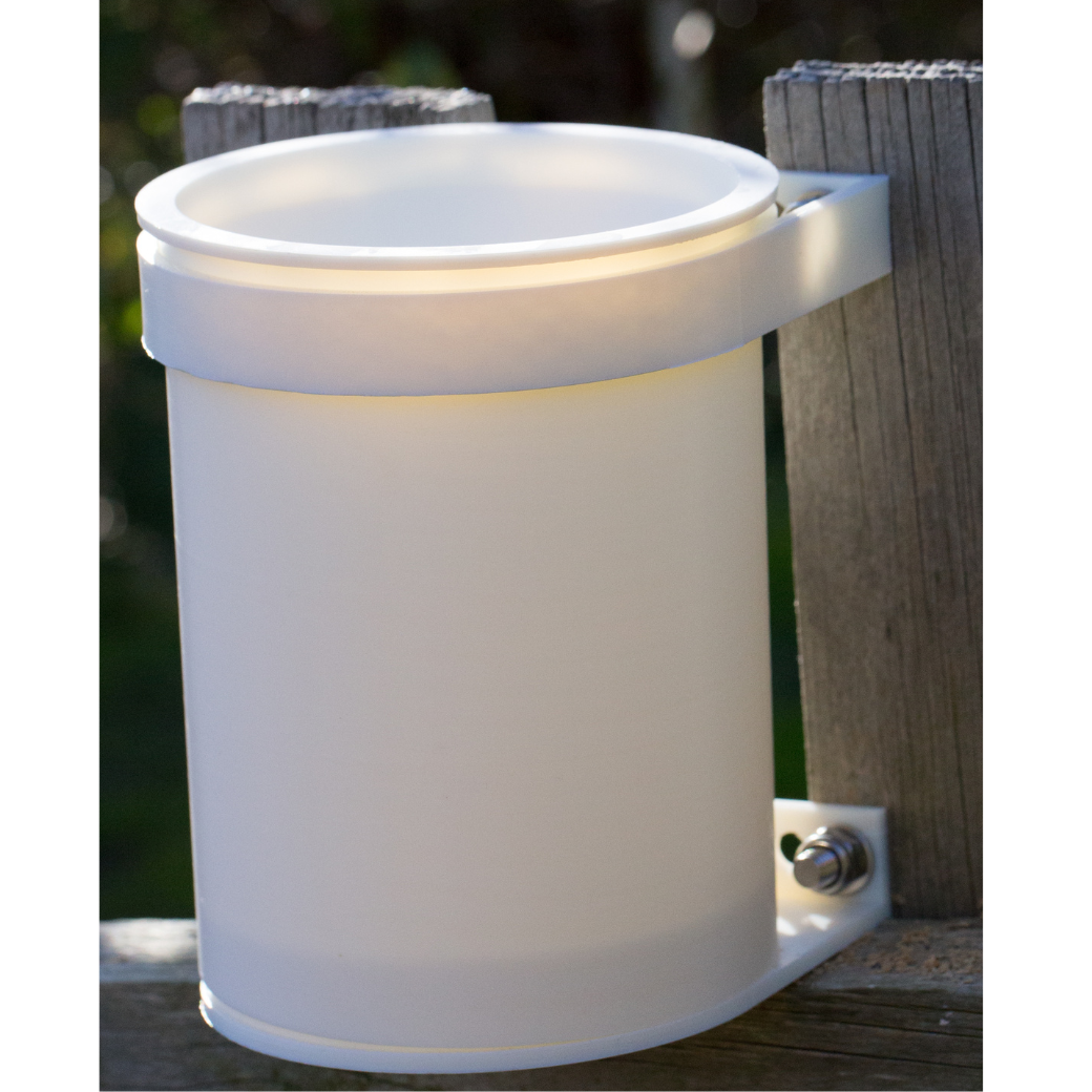 3D printed rain gauge mounted outdoors on a post, showing compact and weatherproof design